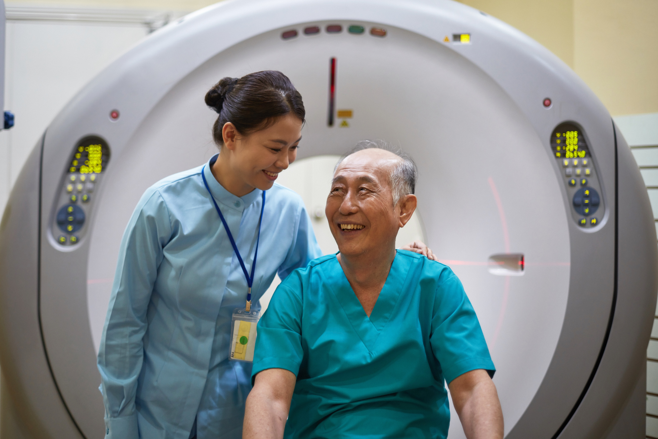 Smiling MRT Looking At Patient After CT Scan